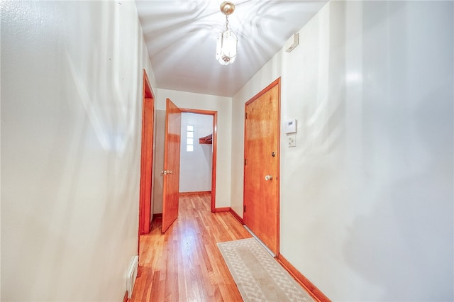 corridor featuring light wood-type flooring