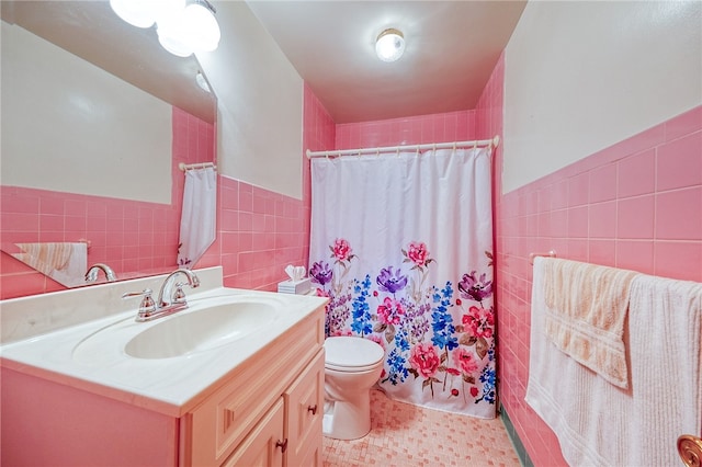 bathroom featuring toilet, tile patterned floors, tile walls, a shower with curtain, and vanity