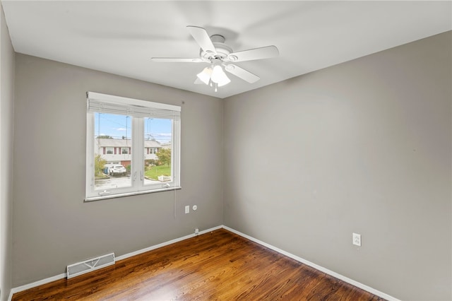 unfurnished room featuring ceiling fan and hardwood / wood-style flooring