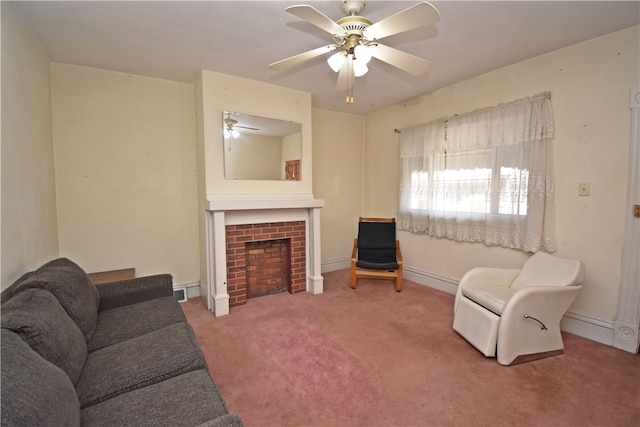 carpeted living room featuring ceiling fan and a brick fireplace