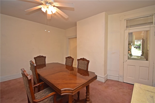 dining area featuring ceiling fan and carpet floors