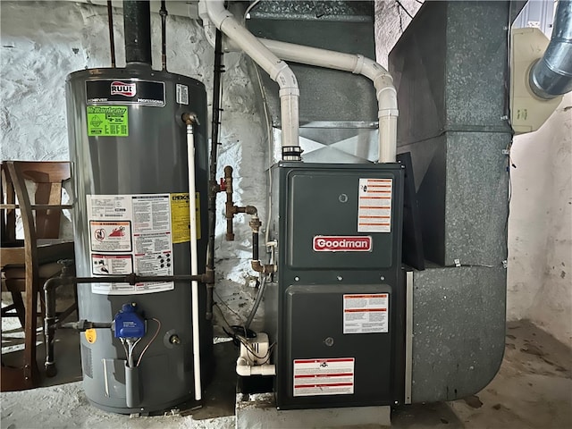 utility room with heating unit and water heater