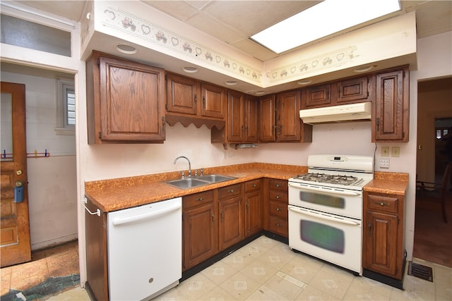 kitchen featuring sink and white appliances