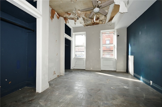 unfurnished bedroom featuring concrete flooring