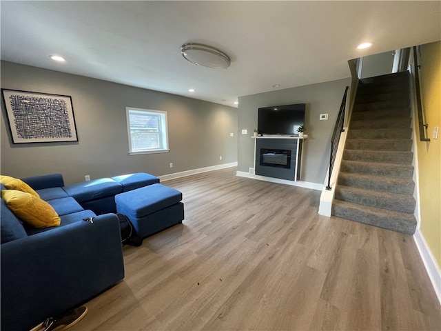 living room with light hardwood / wood-style flooring