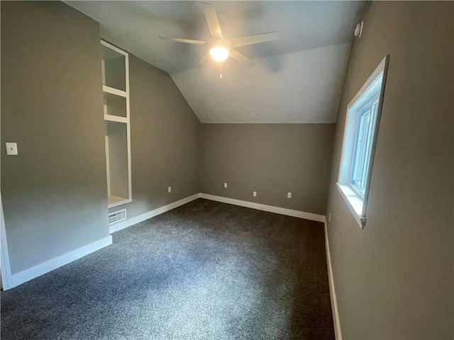 additional living space with lofted ceiling, carpet, and ceiling fan