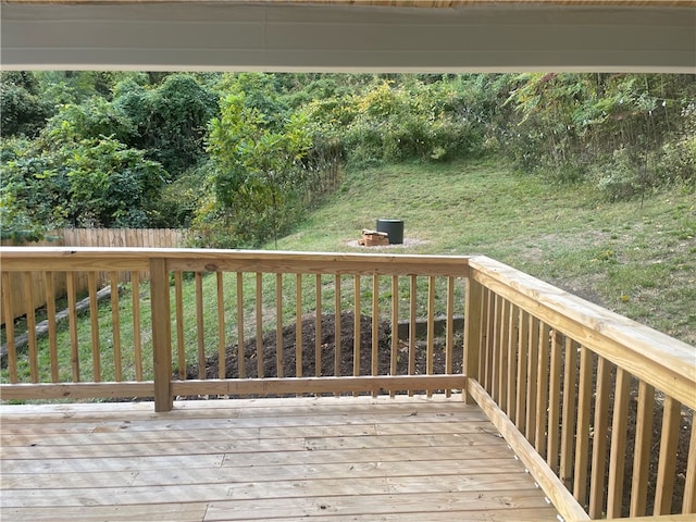 wooden terrace with a yard