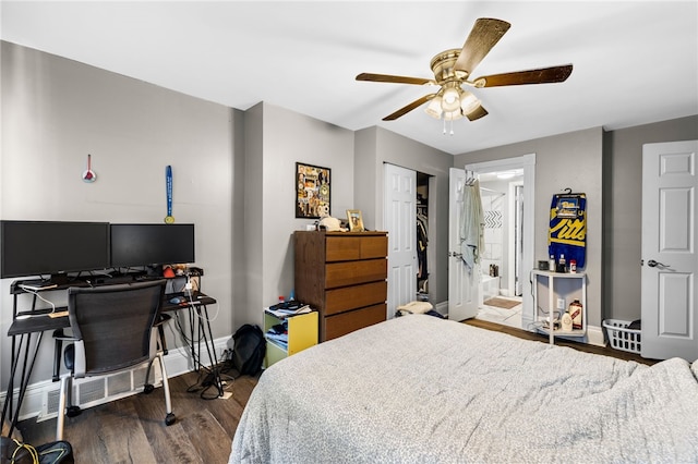 bedroom featuring a closet, hardwood / wood-style floors, ensuite bathroom, and ceiling fan