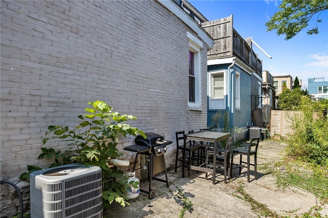 view of patio / terrace with area for grilling and cooling unit