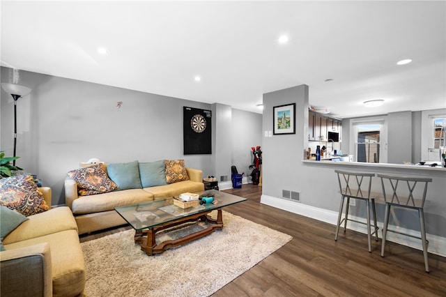 living room with dark hardwood / wood-style floors