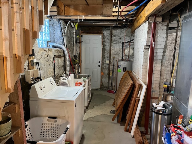 laundry area featuring washing machine and dryer and water heater