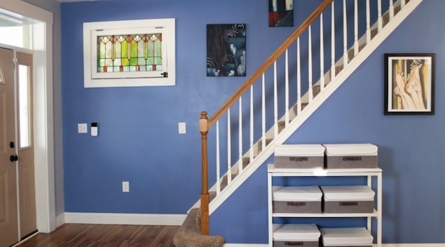 foyer entrance featuring dark hardwood / wood-style floors