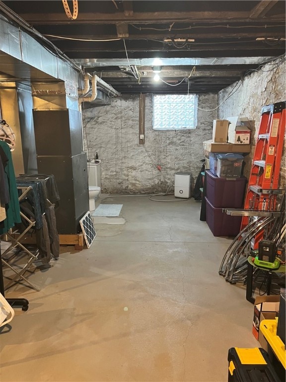 basement featuring heating unit