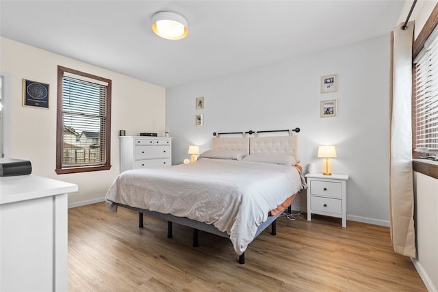 bedroom with light hardwood / wood-style flooring