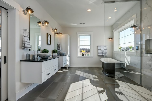 bathroom featuring vanity and shower with separate bathtub