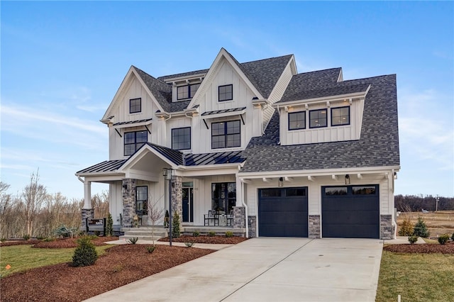 modern farmhouse with a porch, a front yard, and a garage