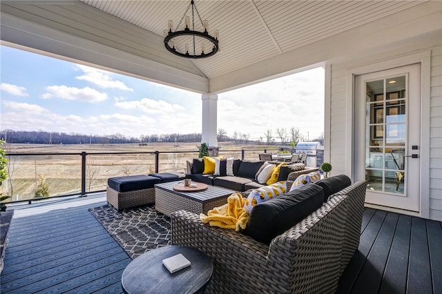 deck featuring a rural view and outdoor lounge area