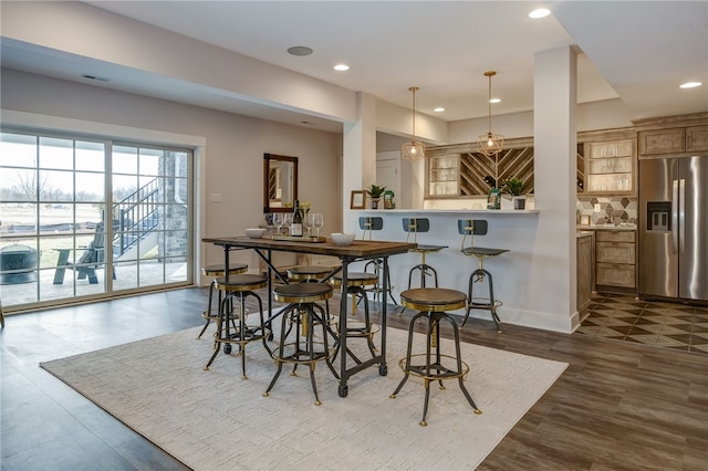 dining area with dark hardwood / wood-style flooring