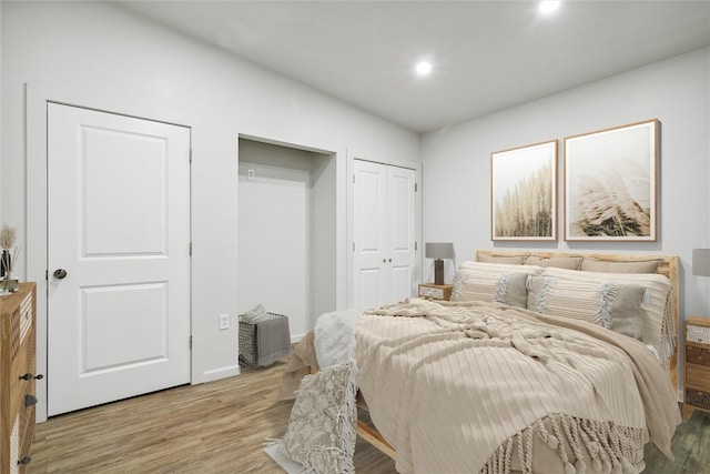 bedroom with light hardwood / wood-style flooring