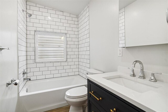 616 S Mathilda St, Bloomfield, PA 15224 - bathroom featuring toilet, vanity, tub / shower combination, and wood finished floors