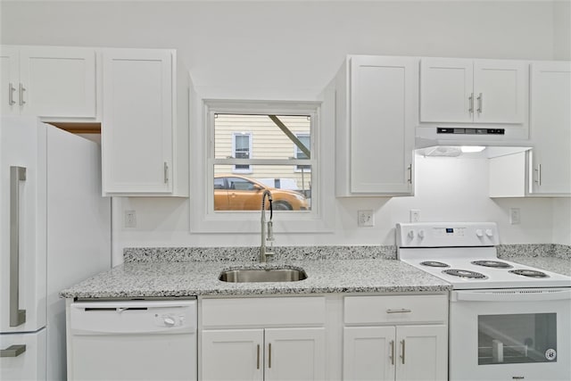 kitchen with white appliances, white cabinetry, and range hood