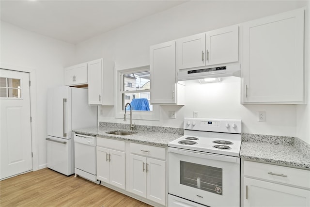 kitchen with light stone counters, sink, white appliances, light hardwood / wood-style flooring, and white cabinetry