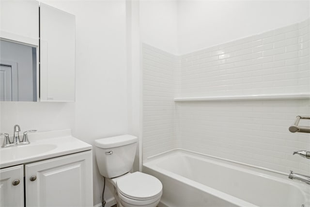 full bathroom with tiled shower / bath combo, vanity, and toilet