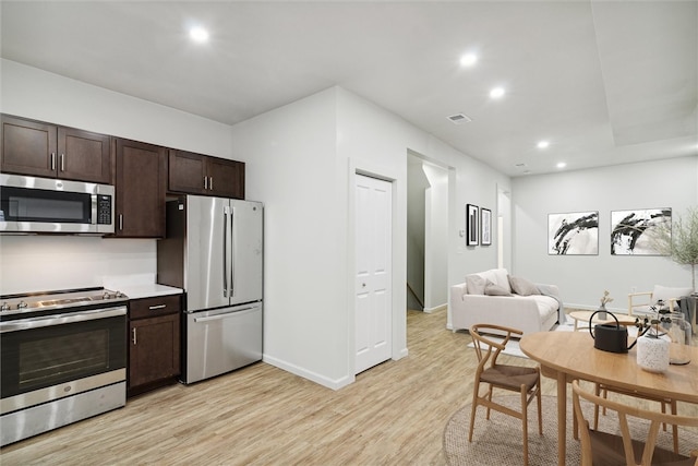 616 S Mathilda St, Bloomfield, PA 15224 - kitchen with appliances with stainless steel finishes, light wood-style floors, dark brown cabinets, recessed lighting, and baseboards
