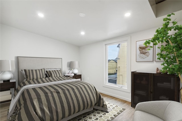 bedroom with light hardwood / wood-style floors