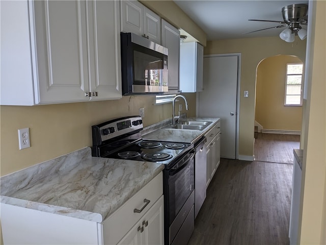 kitchen with stainless steel appliances, dark hardwood / wood-style floors, white cabinets, and sink