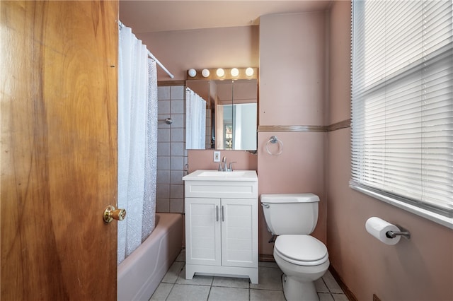 full bathroom with vanity, toilet, shower / bath combo, and tile patterned floors