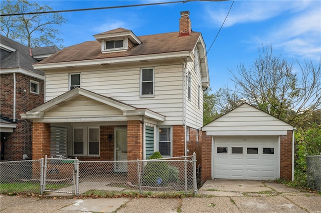 view of front of home featuring a garage, a porch, and an outdoor structure