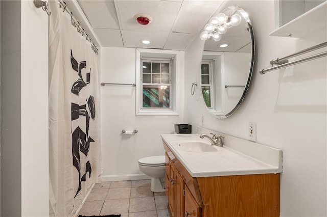 bathroom featuring a shower with curtain, tile patterned floors, vanity, and toilet