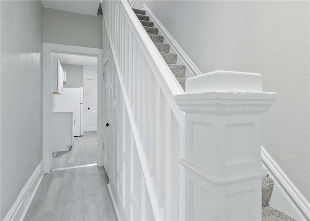 stairs with hardwood / wood-style flooring