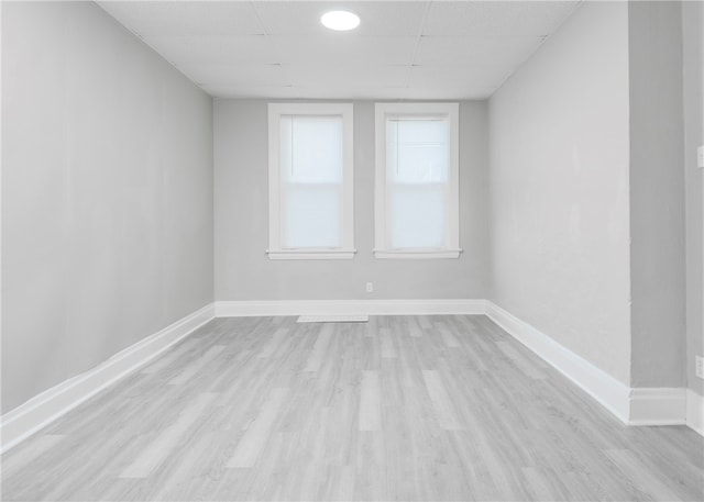 unfurnished room with light hardwood / wood-style floors