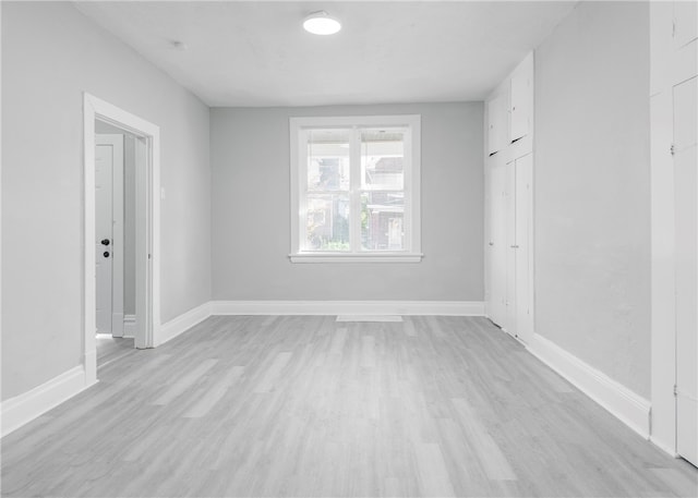 spare room featuring light hardwood / wood-style flooring