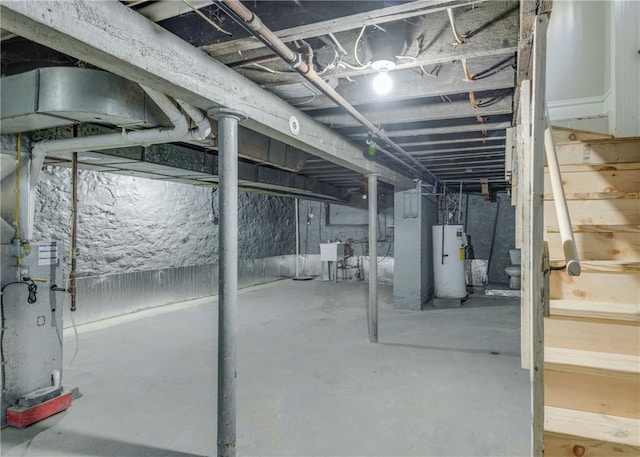 basement with gas water heater and sink