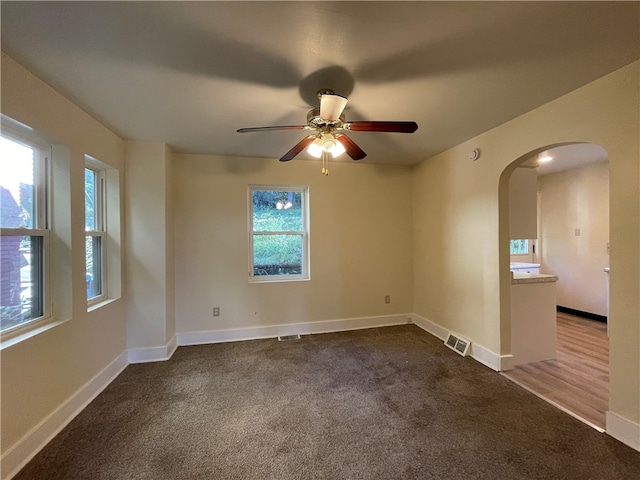 spare room with ceiling fan and carpet flooring