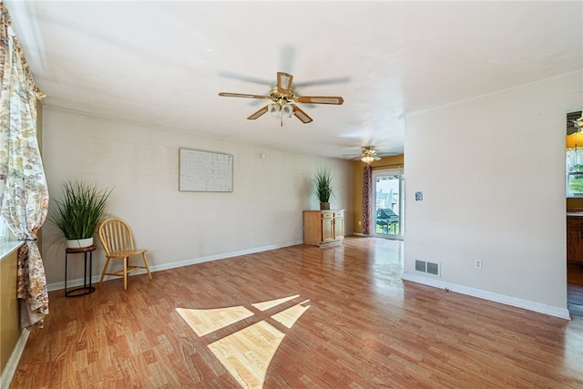 spare room featuring ceiling fan and light hardwood / wood-style flooring