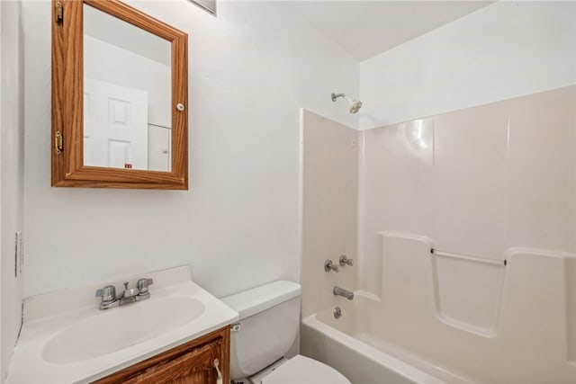 full bathroom with vanity, toilet, and  shower combination