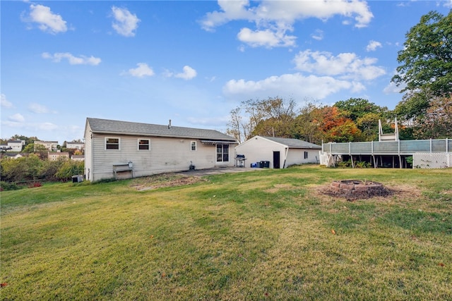 rear view of property with a yard