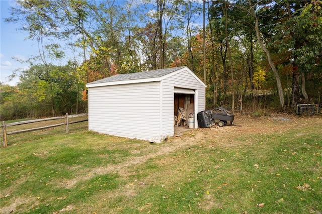 view of outbuilding featuring a yard