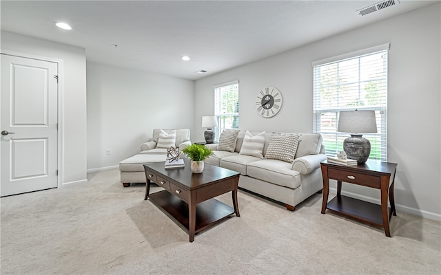 carpeted living room with a wealth of natural light