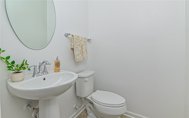 bathroom featuring sink and toilet