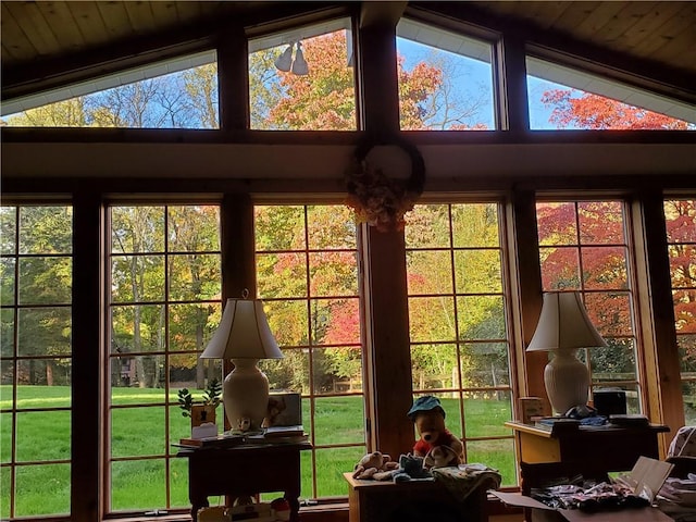 sunroom featuring vaulted ceiling