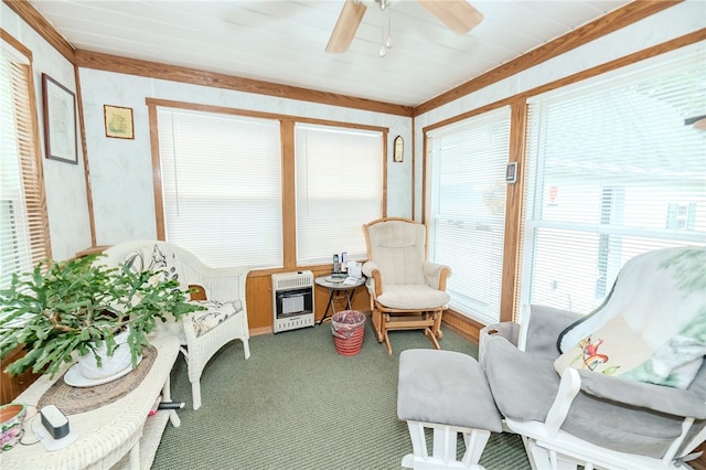 sunroom with heating unit, wooden ceiling, and ceiling fan