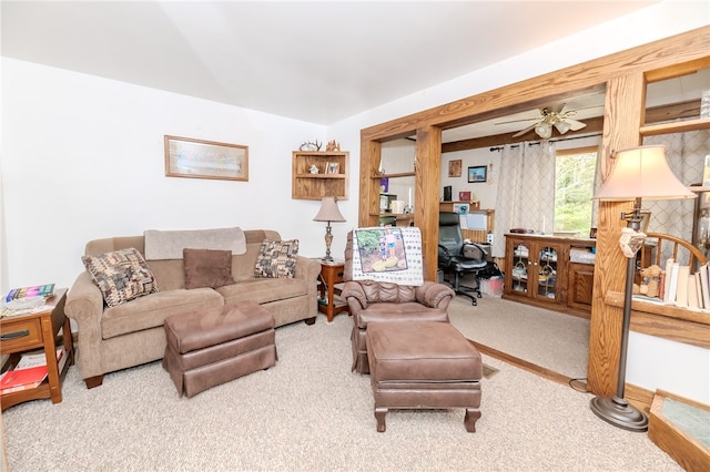 carpeted living room featuring ceiling fan