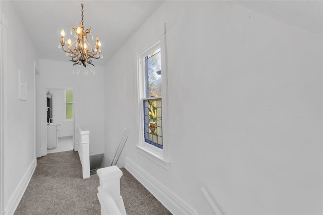 bathroom featuring a notable chandelier