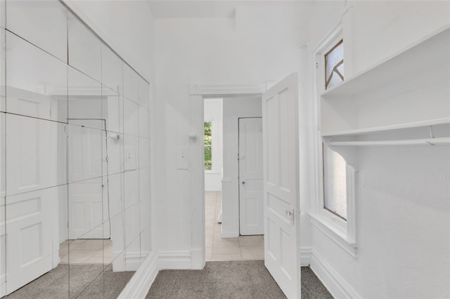 spacious closet with light tile patterned flooring