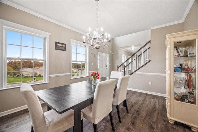 dining room featuring ornamental molding, dark hardwood / wood-style floors, and a chandelier